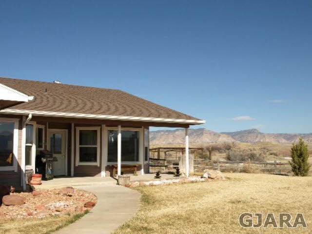 1638 18 Road Fruita, CO 81521 - Photo 11 of 17 a view of a house with a patio
