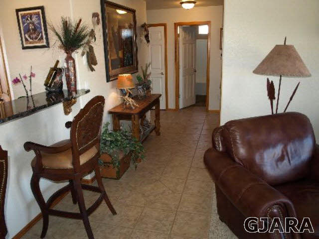 1638 18 Road Fruita, CO 81521 - Photo 4 of 17 a living room with furniture and a flat screen tv