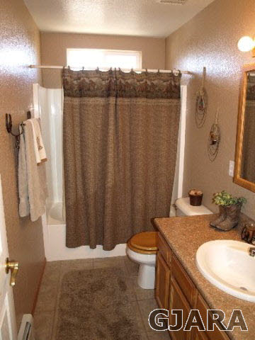 1638 18 Road Fruita, CO 81521 - Photo 5 of 17 a bathroom with a granite countertop sink and a mirror