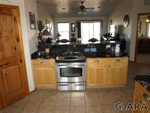1638 18 Road Fruita, CO 81521 - Photo 9 of 17 a kitchen with a stove and a refrigerator