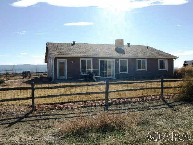 1638 18 Road Fruita, CO 81521 - Photo 10 of 17 a front view of a house with a yard