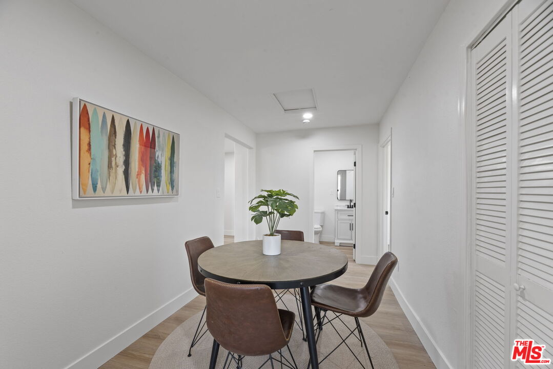 1454 Ricardo Street Los Angeles, CA 90033 - Photo 16 of 27 a view of a dining room with furniture and wooden floor
