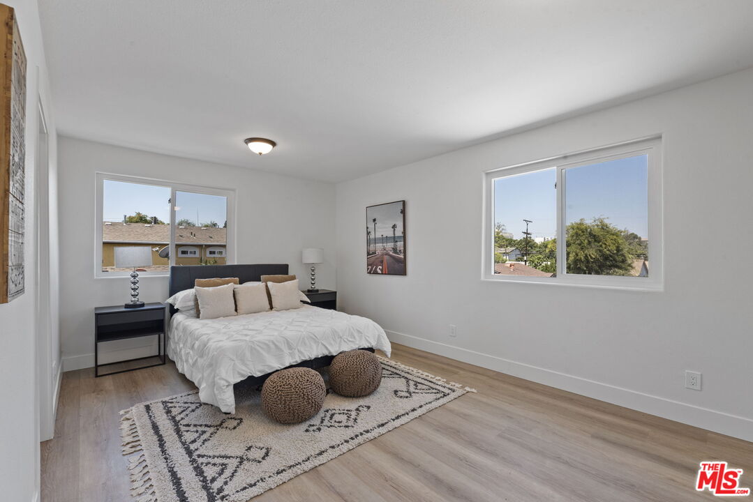 1454 Ricardo Street Los Angeles, CA 90033 - Photo 17 of 27 a bedroom with a bed and a window
