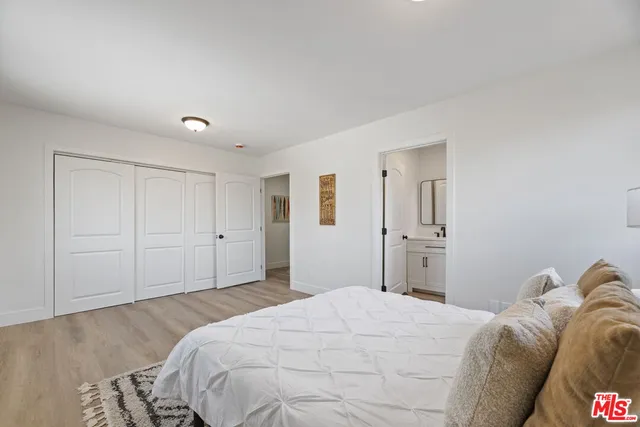 a bedroom with a bed and a cabinets