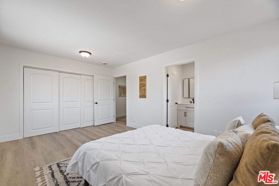 1454 Ricardo Street Los Angeles, CA 90033 - Photo 18 of 27 a bedroom with a bed and a cabinets