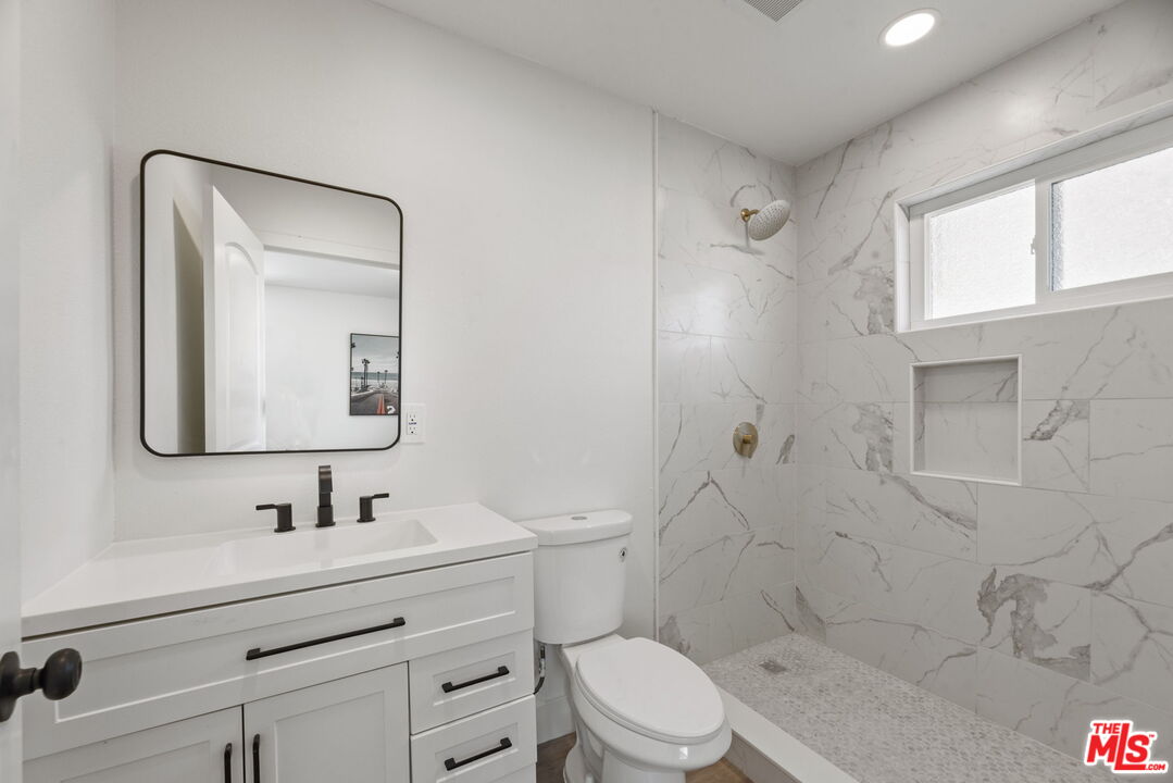 1454 Ricardo Street Los Angeles, CA 90033 - Photo 19 of 27 a bathroom with a sink a toilet and shower