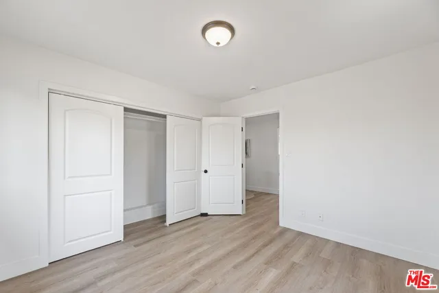 a view of room with wooden floor