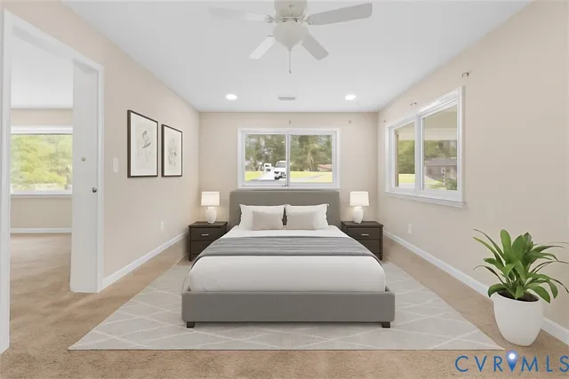 a spacious bedroom with a large bed and a chandelier