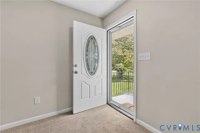a view of a porch with wooden floor and windows