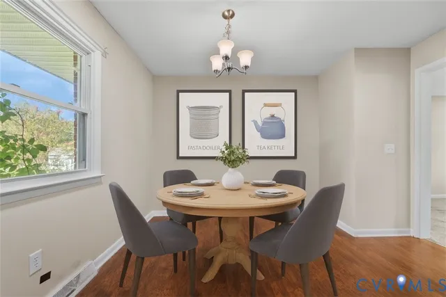 a dining room with furniture and window