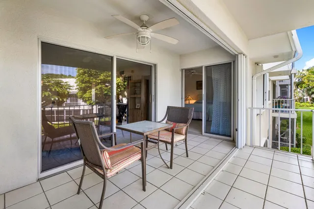 a outdoor space with a large window and couch