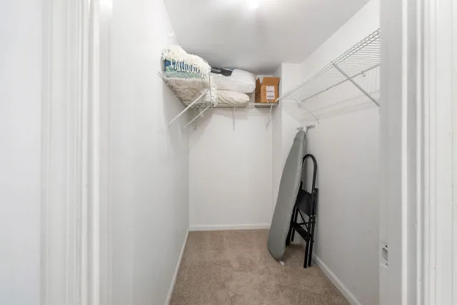 a view of storage and utility room with stairs