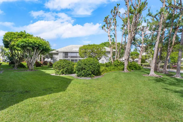 a view of a garden with a building