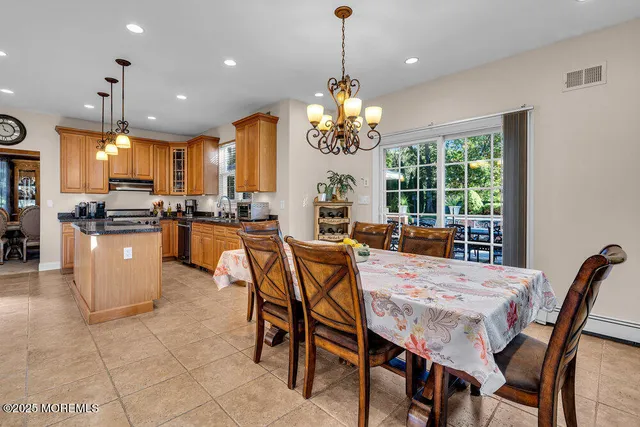 a living room with furniture a fireplace and a potted plant