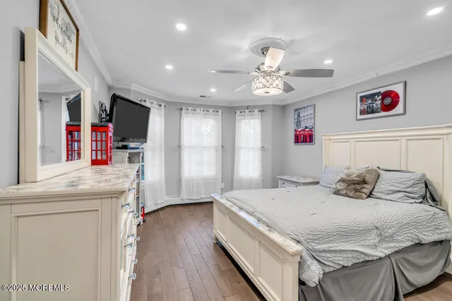 a bedroom with a bed and a potted plant
