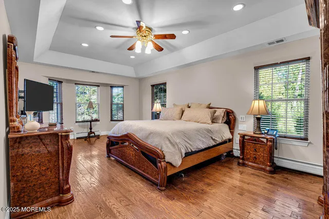 a bathroom with a double vanity sink mirror and shower