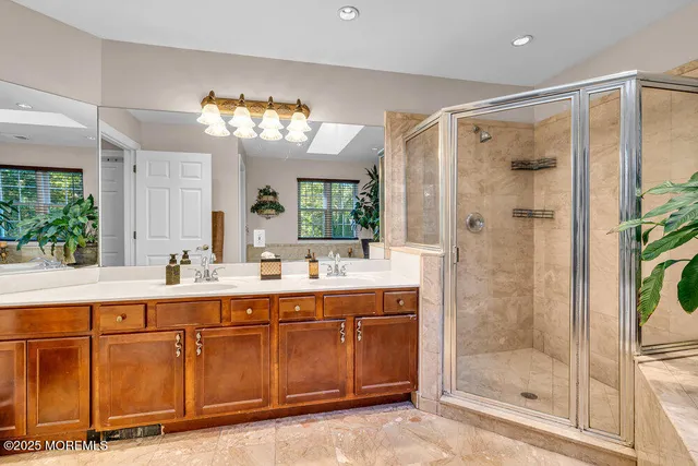 a bathroom with a toilet a sink and a mirror