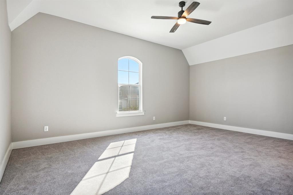 1711 Paytyn Drive Allen, TX 75013 - Photo 18 of 37 Carpeted empty room featuring lofted ceiling and ceiling fan