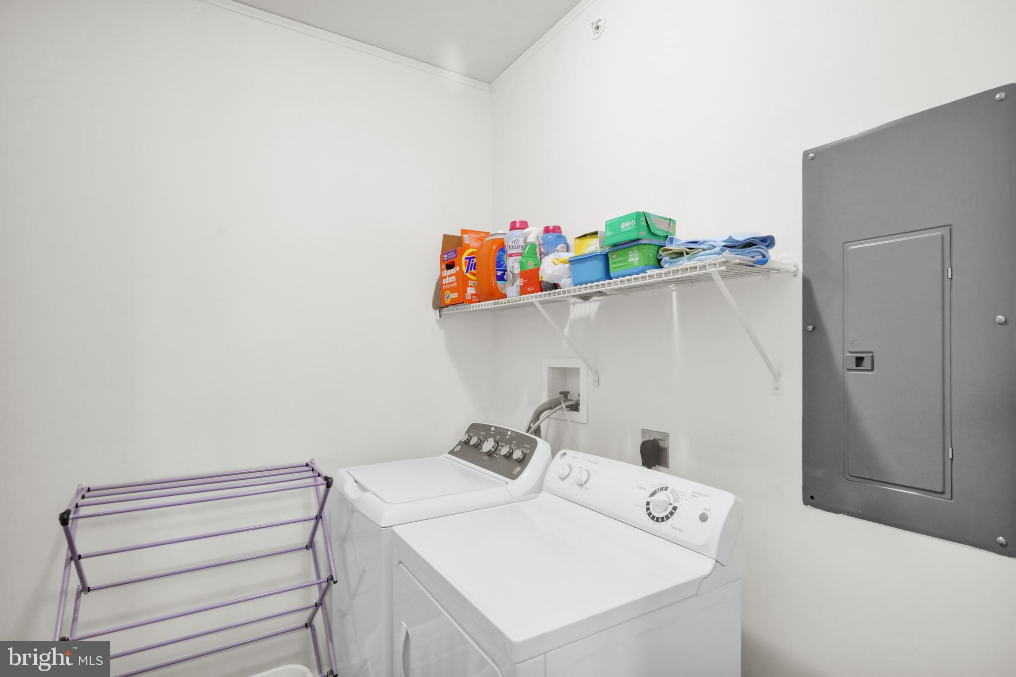 113 Legacy Boulevard, Unit 106 Sinking Spring, PA 19608 - Photo 6 of 9 a utility room with dryer and washer