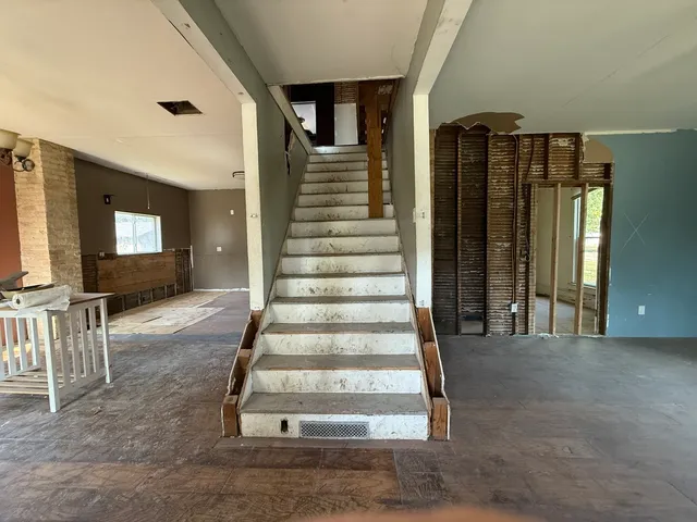a view of a livingroom with furniture and a window