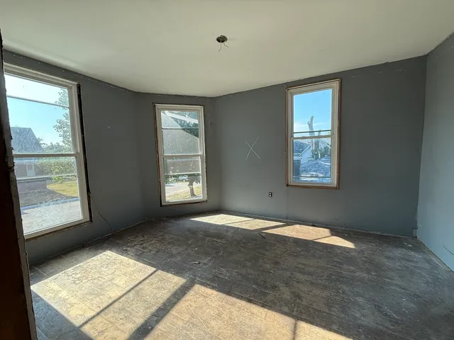 a view of an empty room and window