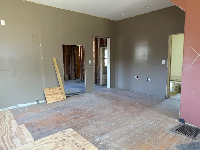 a view of a hallway to a window