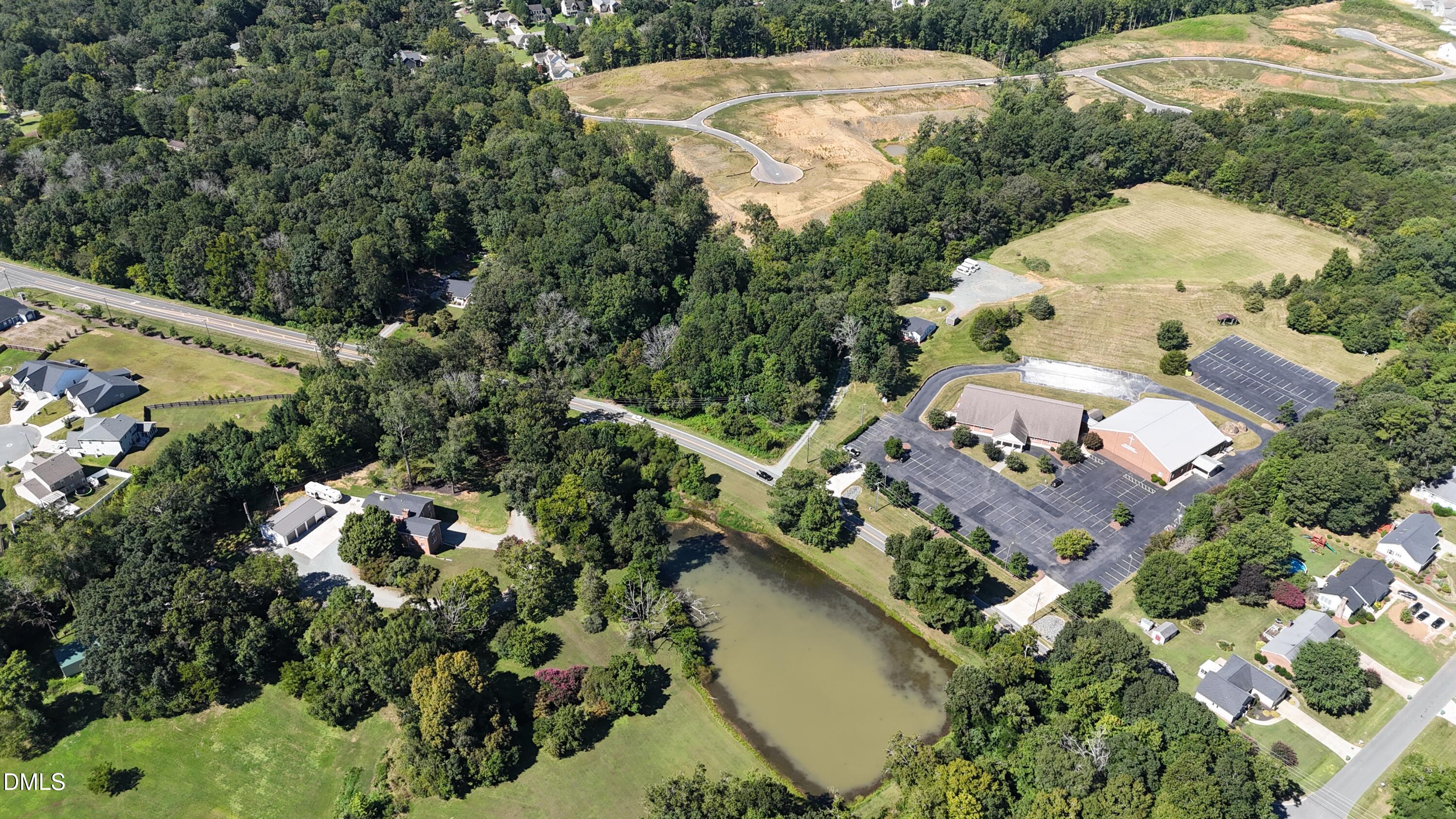 0 Rogers Road Graham, NC 27253 - Photo 2 of 7 an aerial view of a house with a yard and lake view