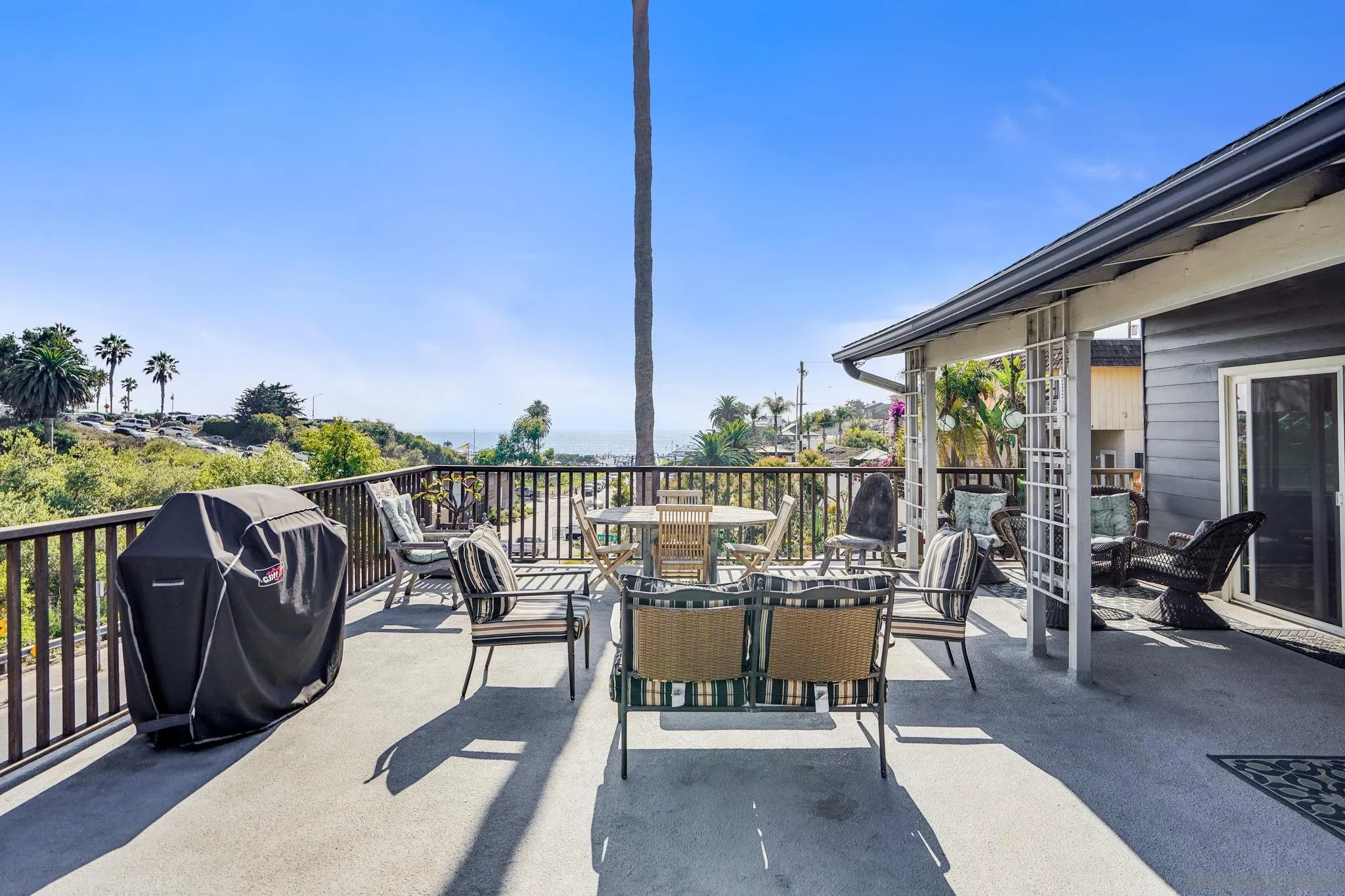 253 B Street Encinitas, CA 92024 - Photo 11 of 61 a view of a balcony with chairs and a table