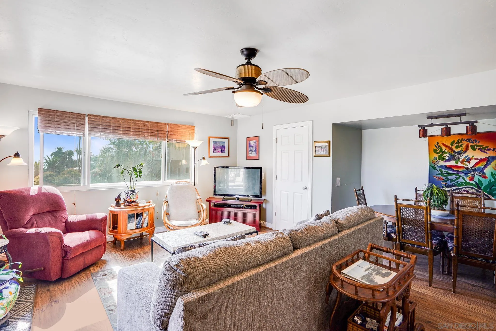 253 B Street Encinitas, CA 92024 - Photo 15 of 61 a living room with furniture a flat screen tv and a large window