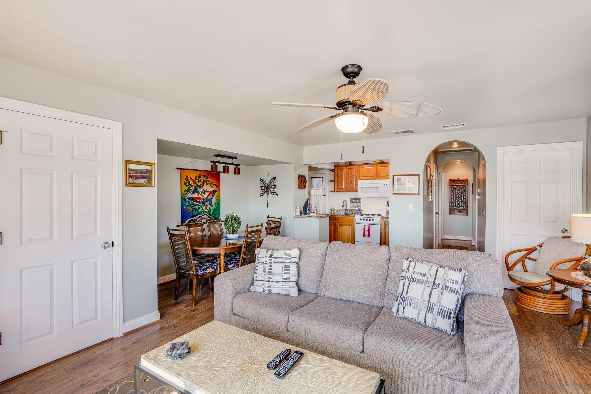 253 B Street Encinitas, CA 92024 - Photo 16 of 61 a living room with furniture a chandelier and a window
