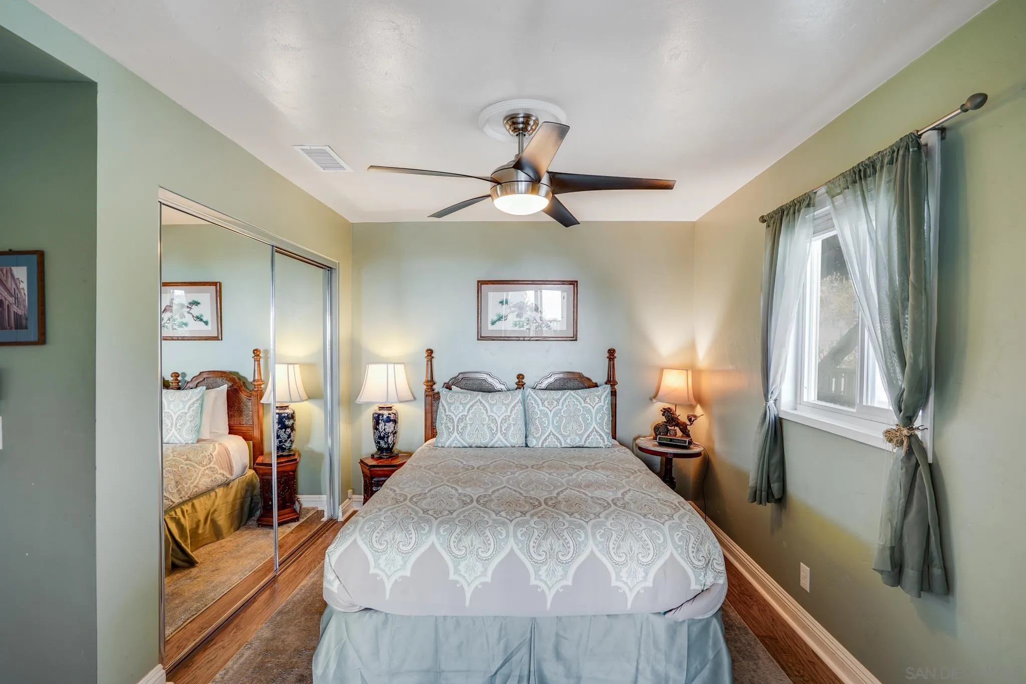 253 B Street Encinitas, CA 92024 - Photo 27 of 61 a bed room with a bed and a chandelier