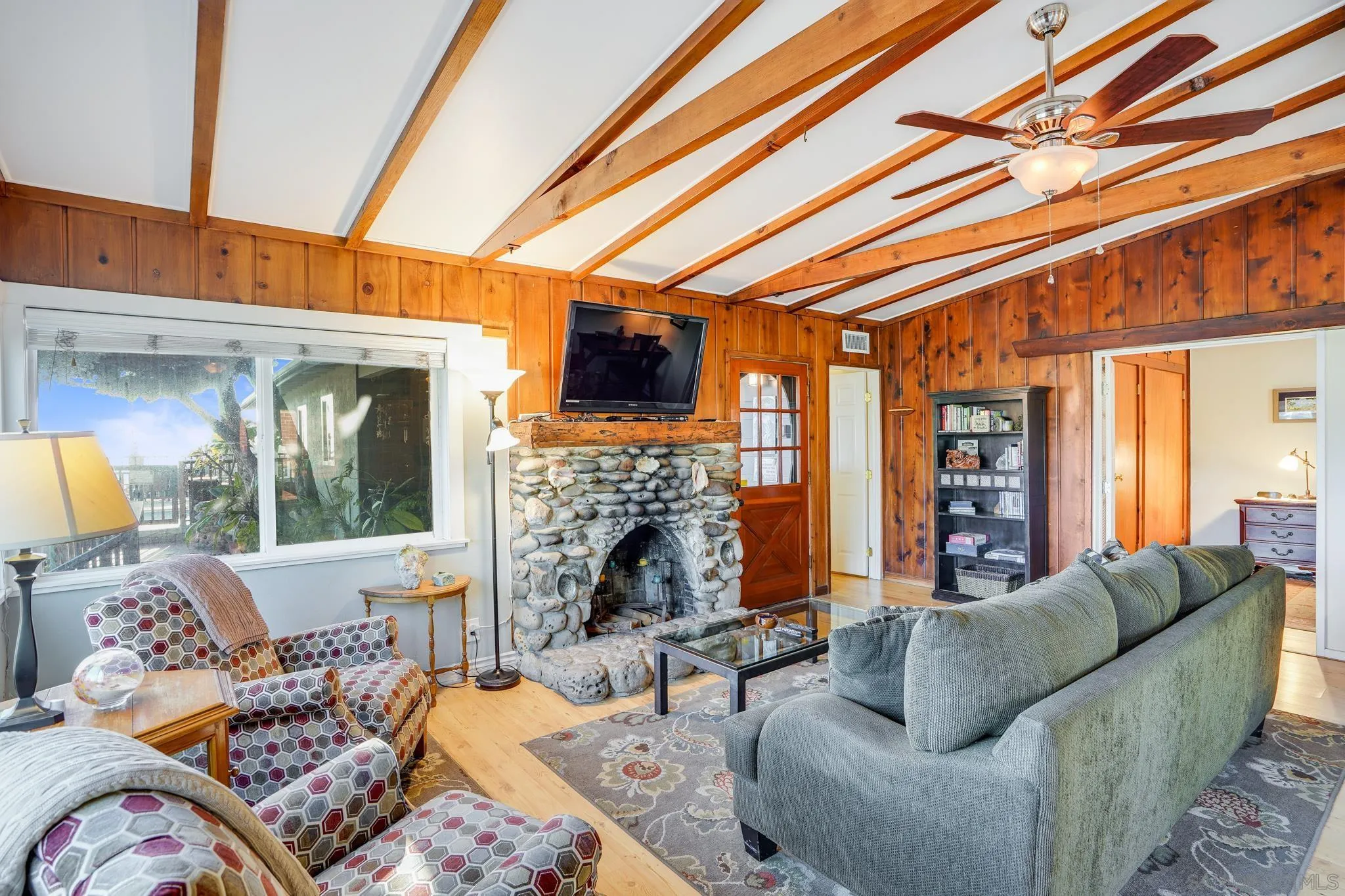253 B Street Encinitas, CA 92024 - Photo 35 of 61 a living room with fireplace furniture and a large window