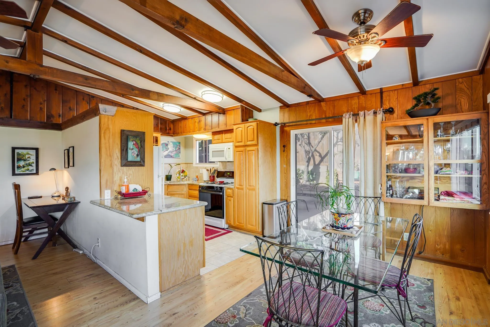 253 B Street Encinitas, CA 92024 - Photo 36 of 61 a living room with furniture and a chandelier