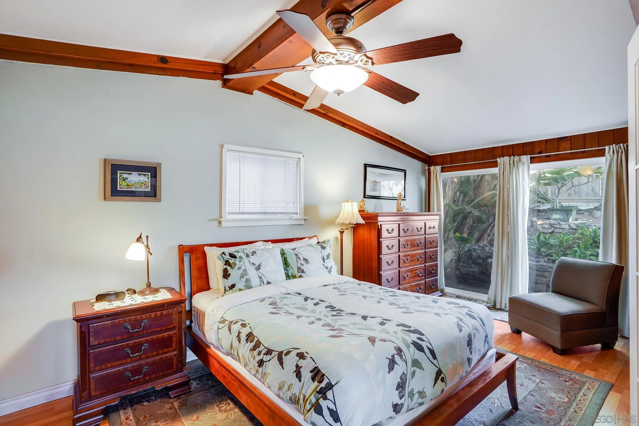 253 B Street Encinitas, CA 92024 - Photo 42 of 61 a bedroom with a bed and a large window