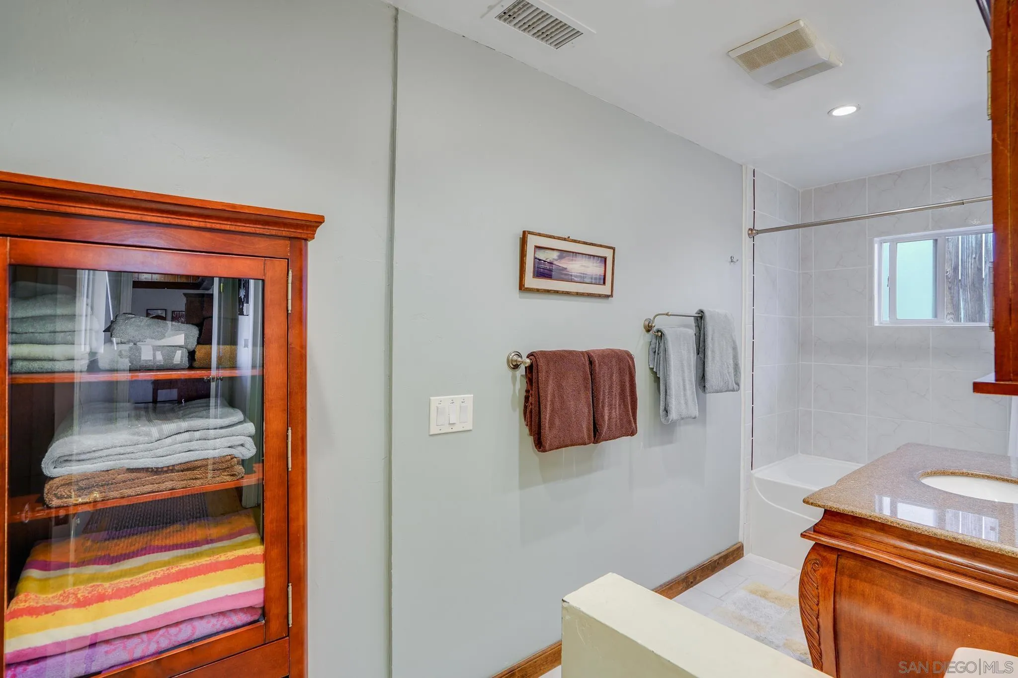 253 B Street Encinitas, CA 92024 - Photo 46 of 61 a bedroom with a bed and furniture