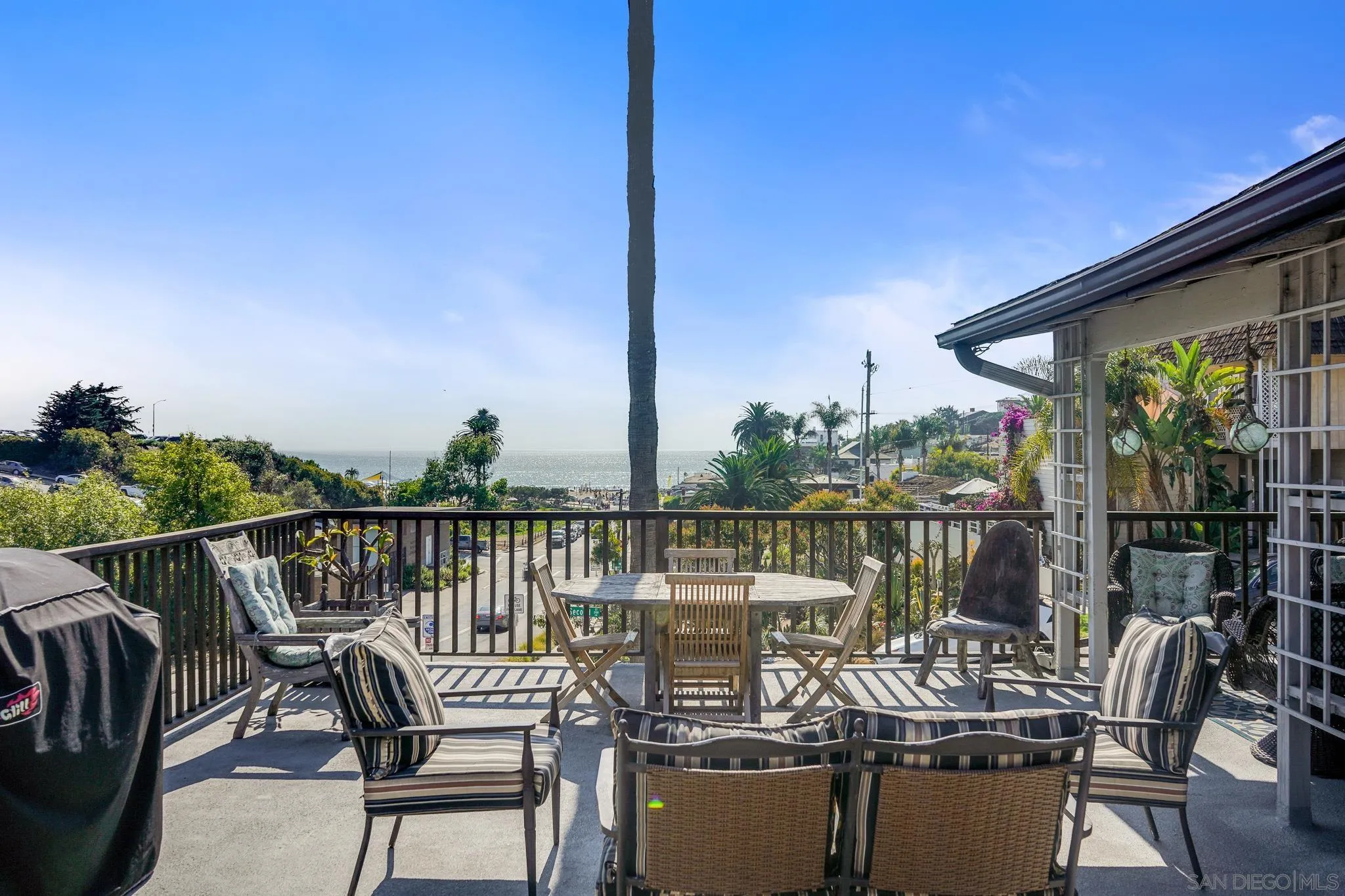253 B Street Encinitas, CA 92024 - Photo 5 of 61 a view of a balcony with chairs and wooden fence