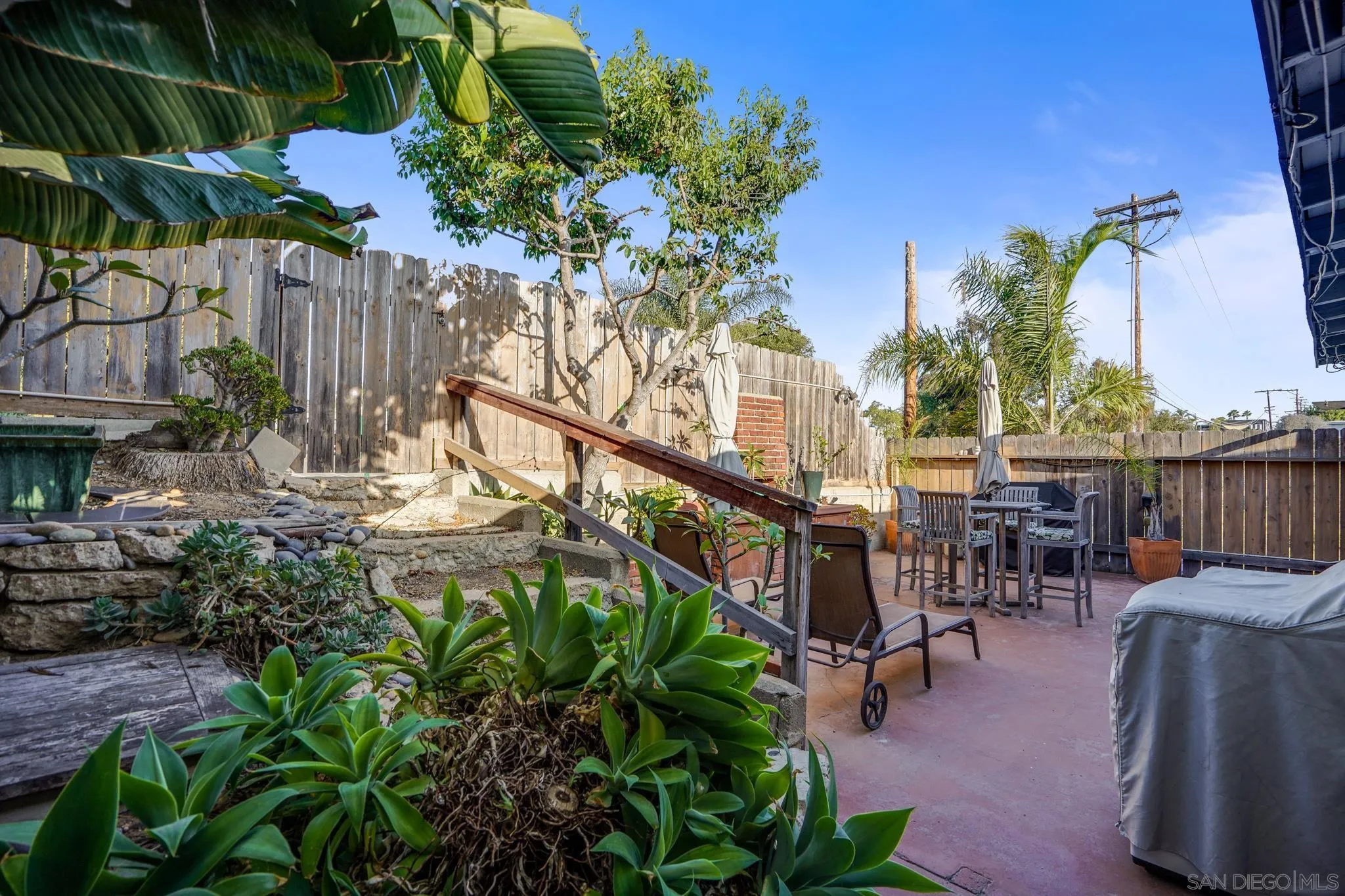 253 B Street Encinitas, CA 92024 - Photo 53 of 61 a backyard of a house with table and chairs