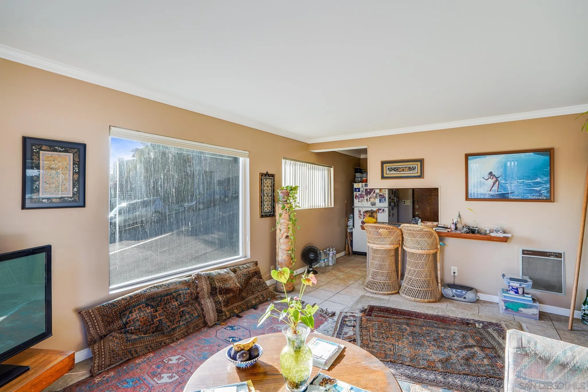 253 B Street Encinitas, CA 92024 - Photo 54 of 61 a living room with furniture a rug a lamp and a window