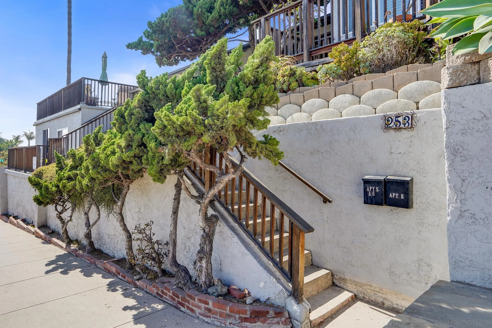 253 B Street Encinitas, CA 92024 - Photo 8 of 61 a view of a house with wooden stairs