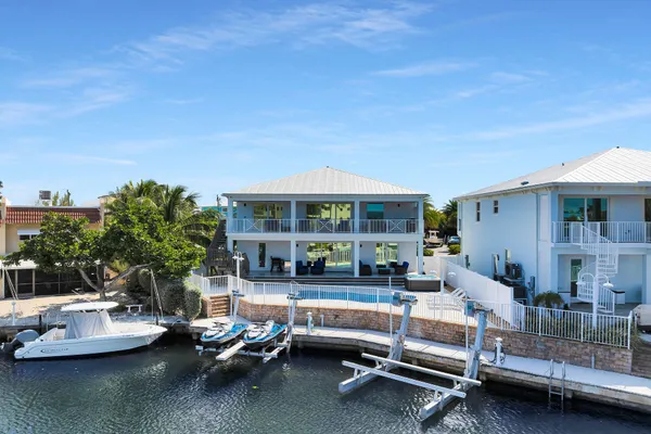 a view of a house with swimming pool
