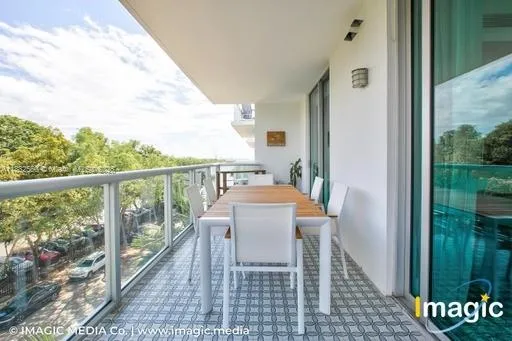 a living room with lots of furniture and white walls