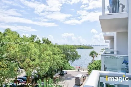 a view of a balcony with table and chairs
