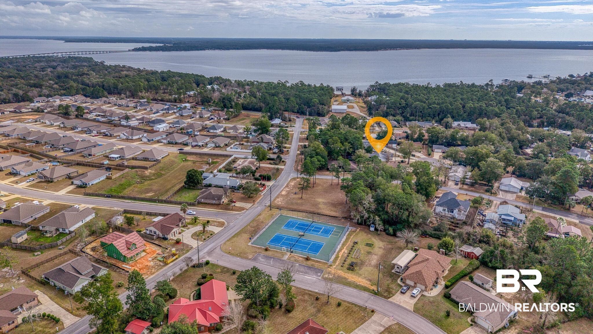 2776 Santa Rosa Circle Lillian, AL 36549 - Photo 7 of 48 Aerial view of residential area featuring a large body of water