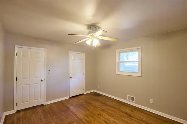a view of an empty room with a window