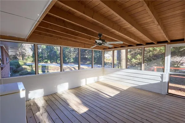 a view of a patio with wooden floor