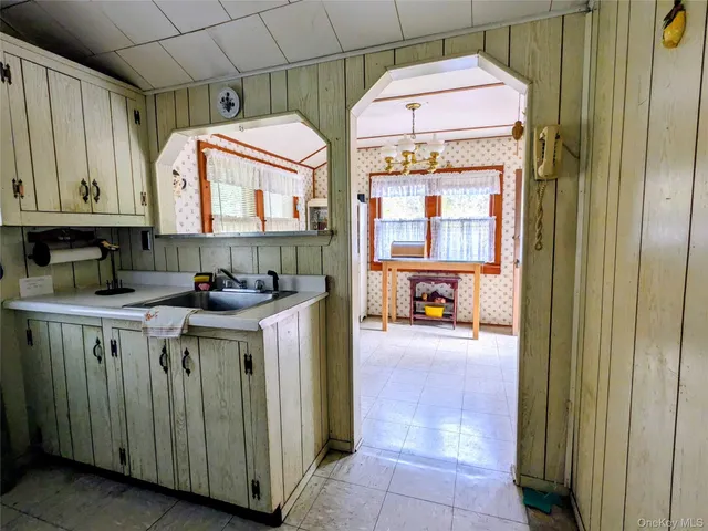 a kitchen with a sink and a cabinets