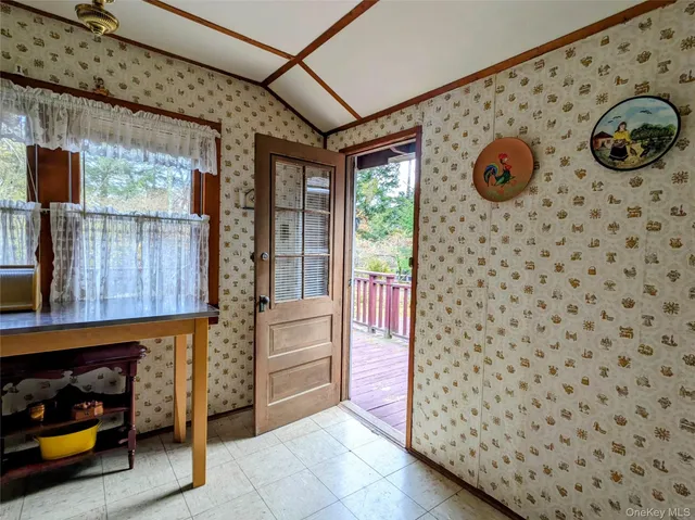 a view of a door and chair in the room