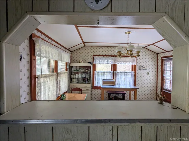 a living room with furniture and fireplace