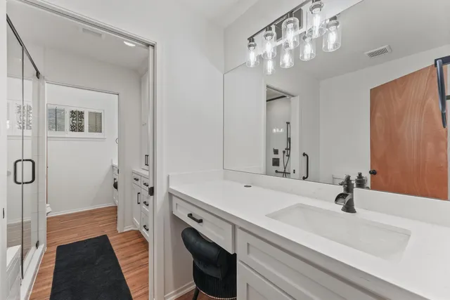 a view of a chairs and table in a patio