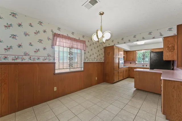 a view of a kitchen with a sink and dishwasher